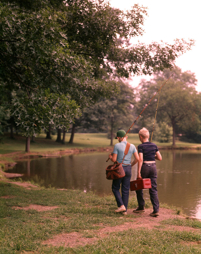 Detail of 1970s 1960s Two Boys Walking Beside Fishing Pond by Corbis