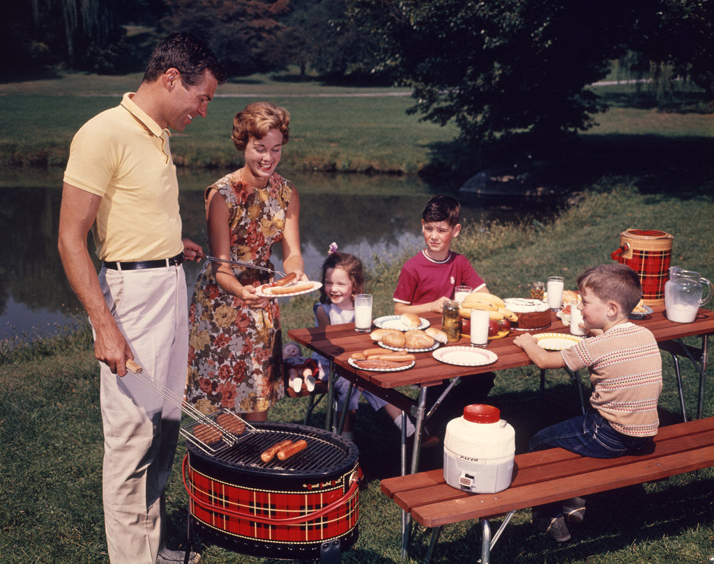Detail of 1960s Family Father Mother Two Sons Daughter Enjoying Outdoor Bar-B-Cue by Anonymous