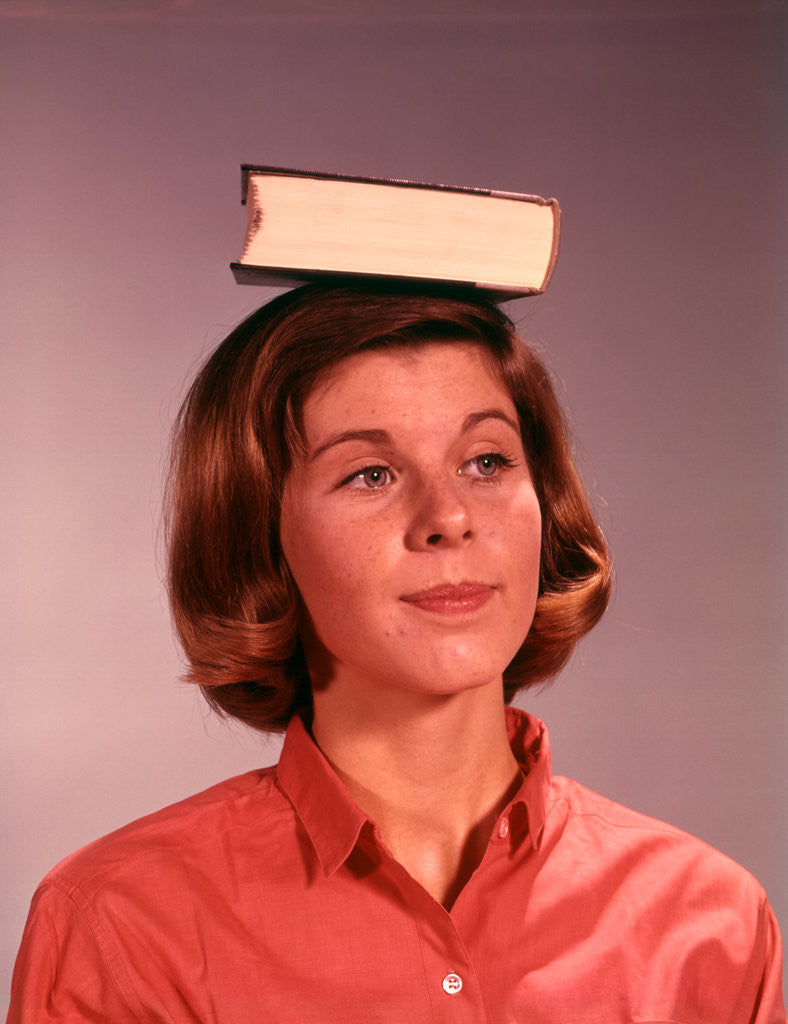 Detail of 1960s 1970s Young Woman Girl Balancing Book On Head by Anonymous