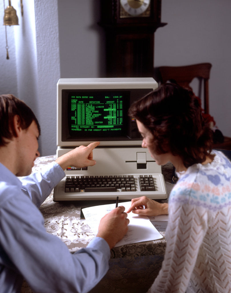 Detail of 1980s Teenage Couple Boy And Girl Working Together On Apple Iii Personal Computer by Anonymous
