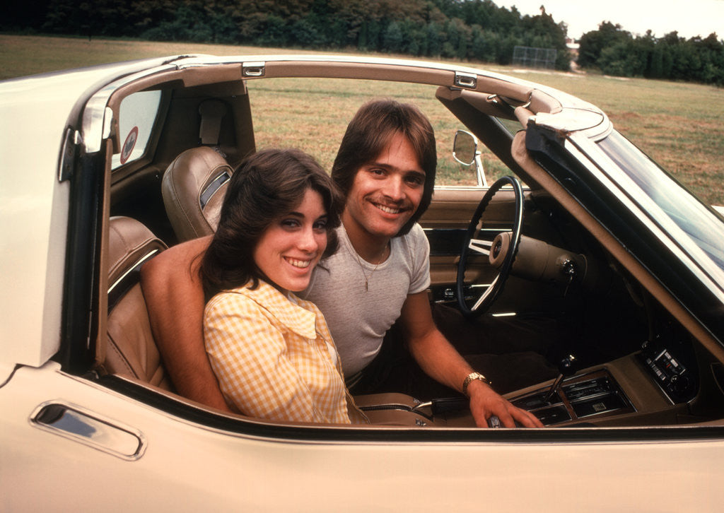 Detail of 1970s Young Couple Man Woman Sitting Cockpit Of Chevrolet Corvette Car Sports by Anonymous