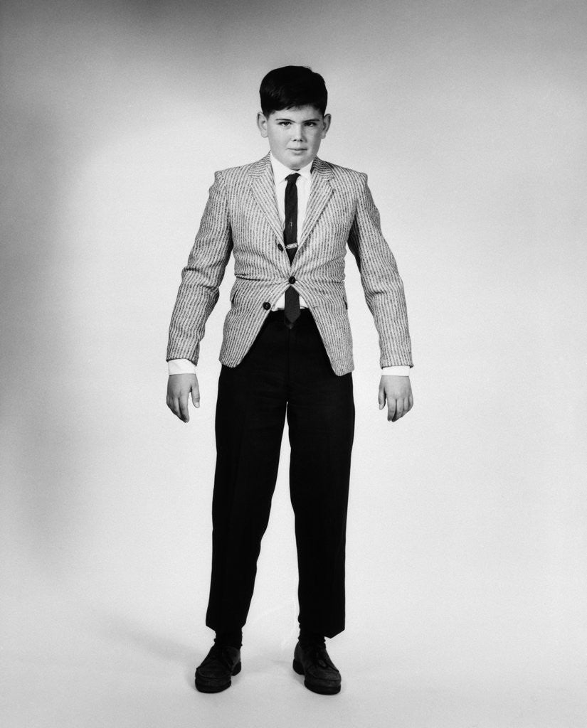 Detail of 1950s 1960s Overgrown Boy In Tight Suit by Anonymous