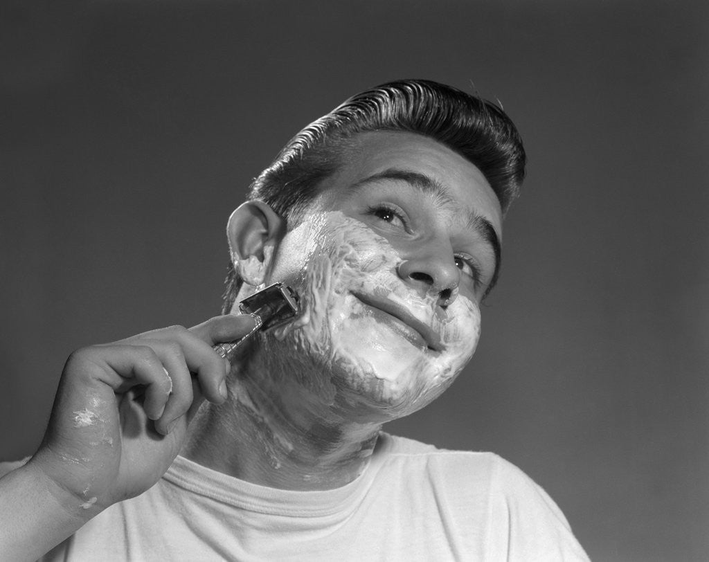 Detail of 1950s Young Man Shaving With Safety Razor by Anonymous