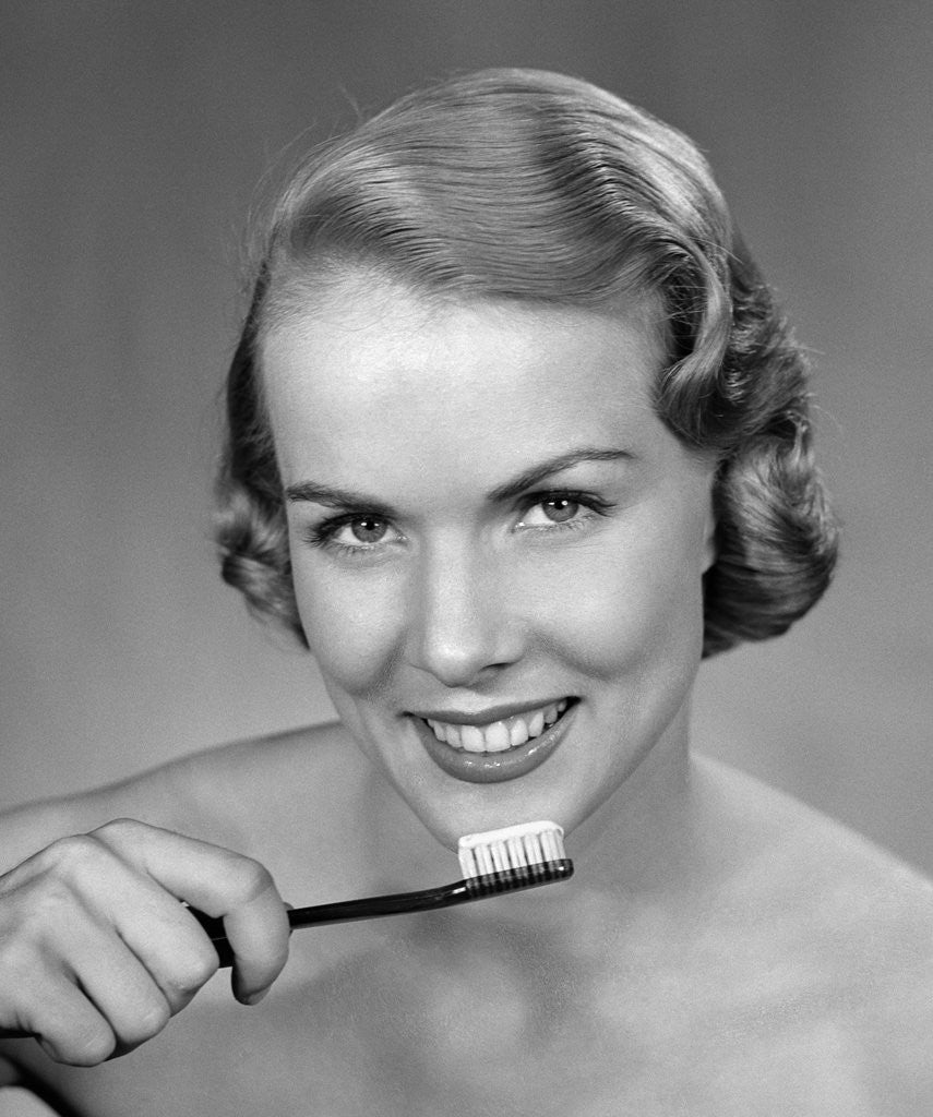 Detail of 1950s Woman Holding Tooth Brush by Anonymous