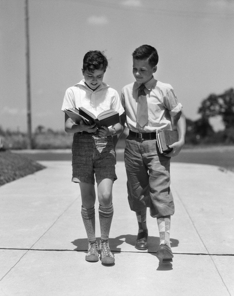 Detail of 1930s Two Boys Walking School Reading Books by Corbis