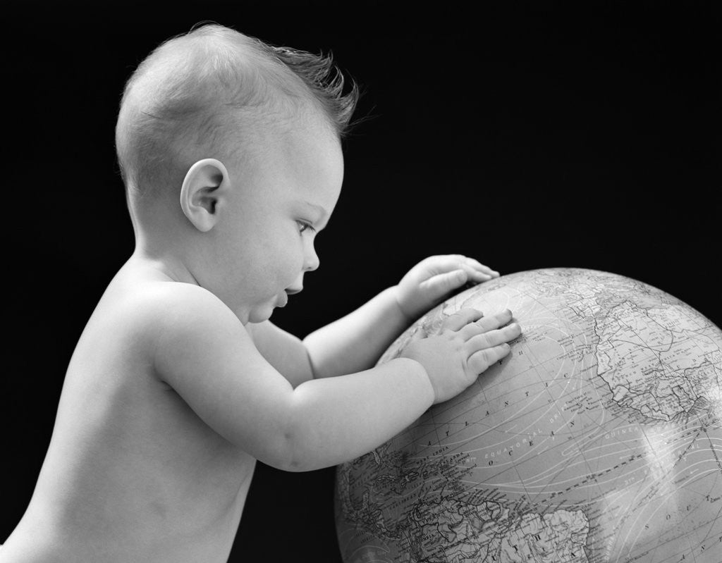 Detail of 1940s Baby With Hands On Globe Looking At The Earth by Anonymous