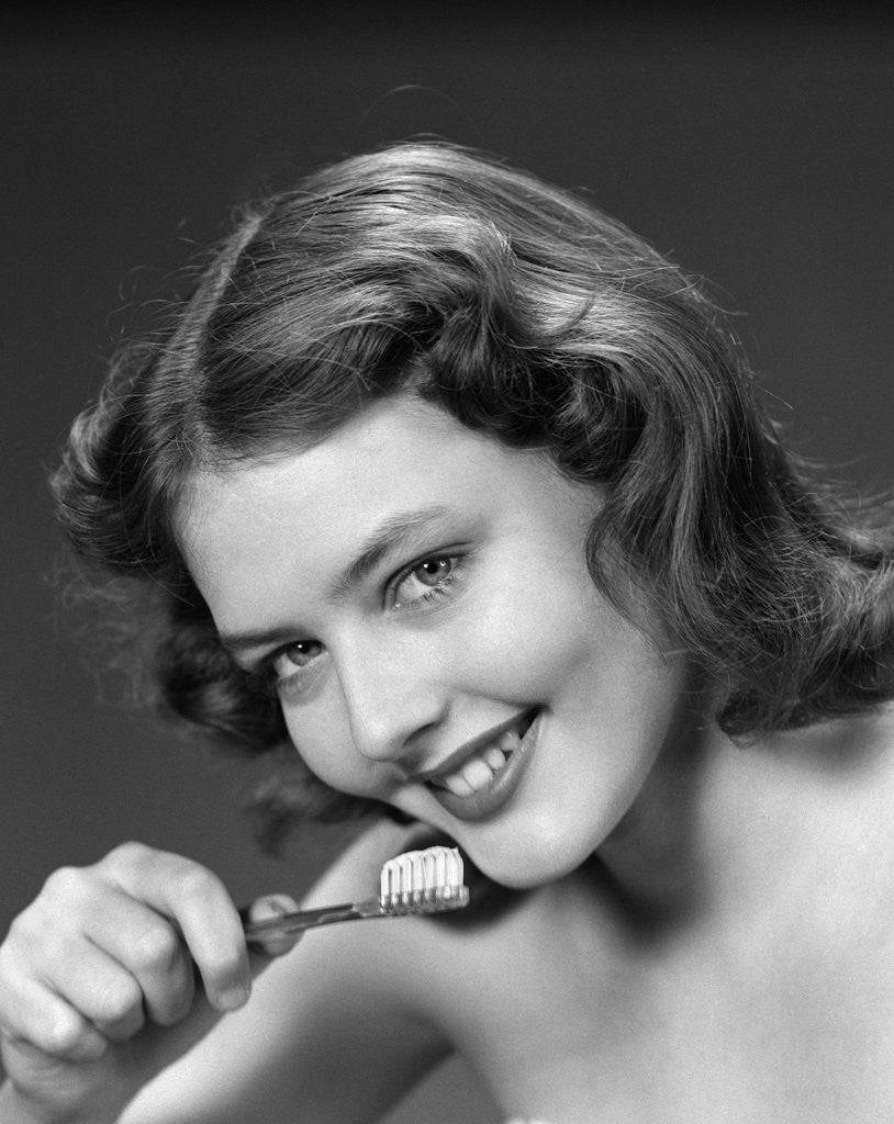 Detail of 1940s 1950s Woman Holding Tooth Brush by Anonymous