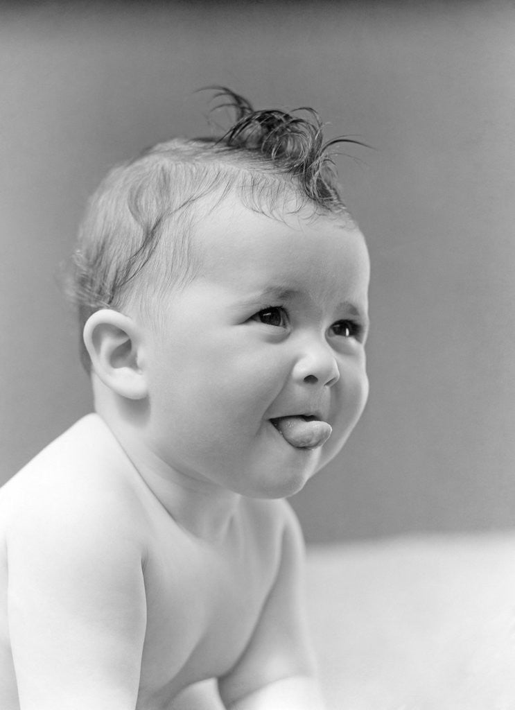 Detail of 1940s Cute Baby Sticking Out Tongue Studio by Anonymous