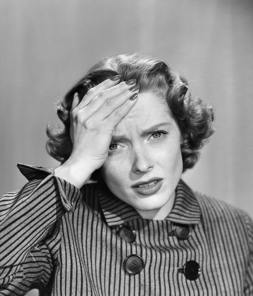 Detail of 1950s Stressed Woman In Striped Dress Hold Forehead With Hand by Anonymous