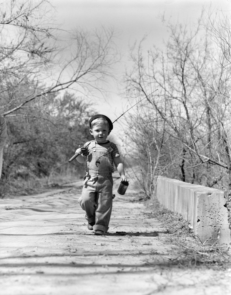 Detail of 1940s Boy Walking Down Country Road With Can Of Worms And Fishing Pole by Anonymous