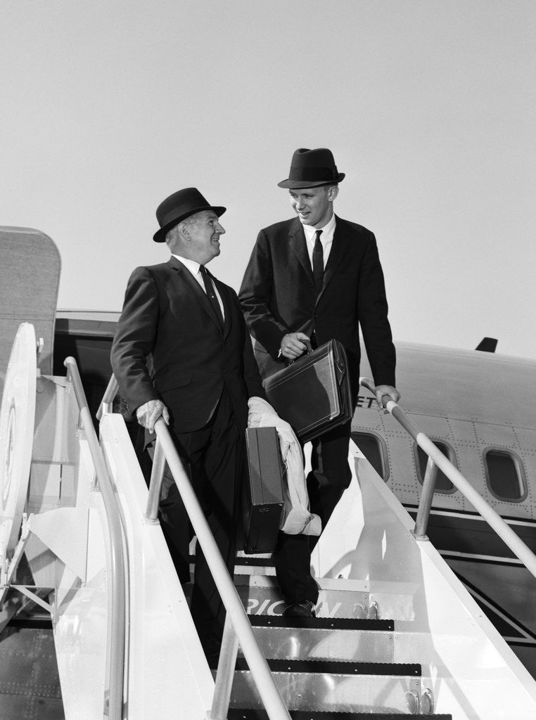 Detail of 1960s Two Business Men Briefcase Exit Airplane Steps by Anonymous
