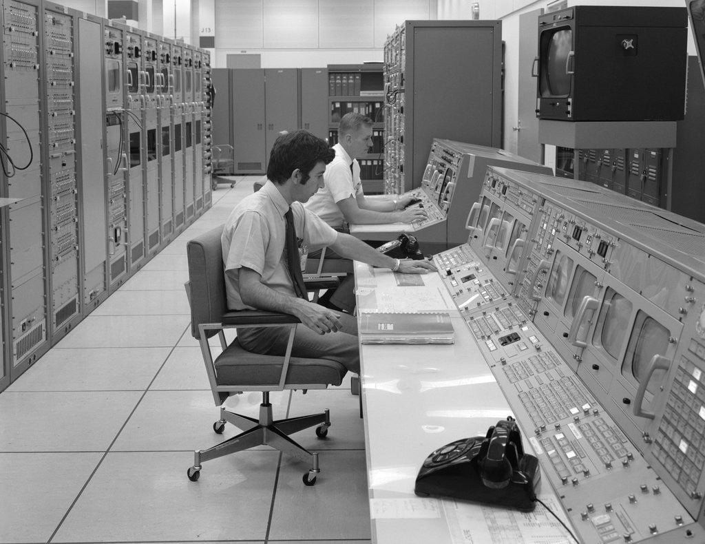 Detail of 1960s 1970s Computer Room Mission Control Center Houston Texas 2 Men Sitting At Console by Anonymous