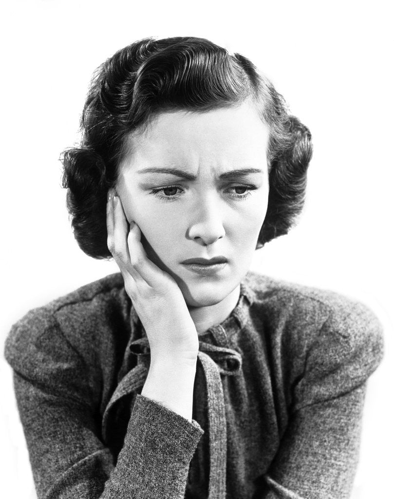 Detail of 1940s Worried Woman Frowning Holding Hand To Cheek by Anonymous