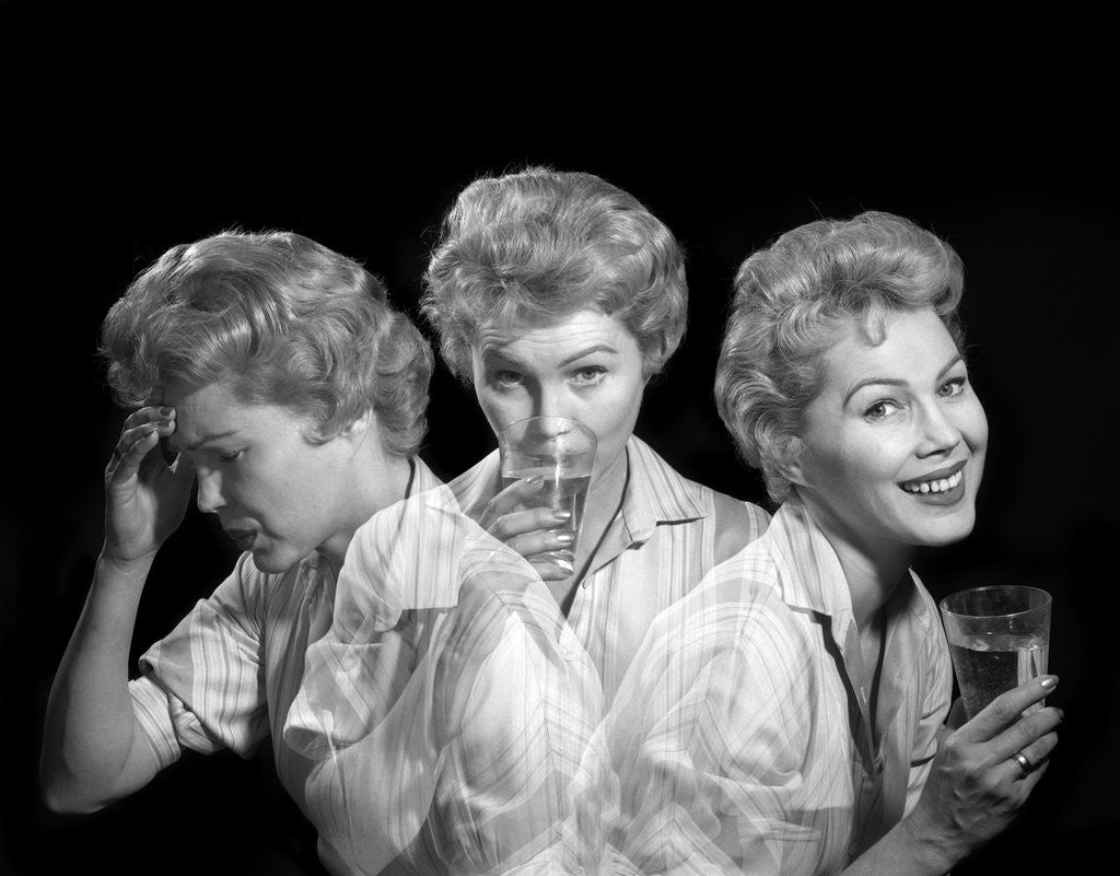 Detail of 1950s 1960s Woman With A Headache Taking Medicine And With Expression Of Relief From Pain by Anonymous