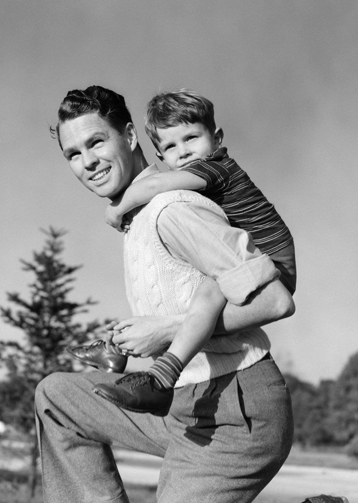 Detail of 1940s Father Carrying Son Piggyback On Back by Anonymous