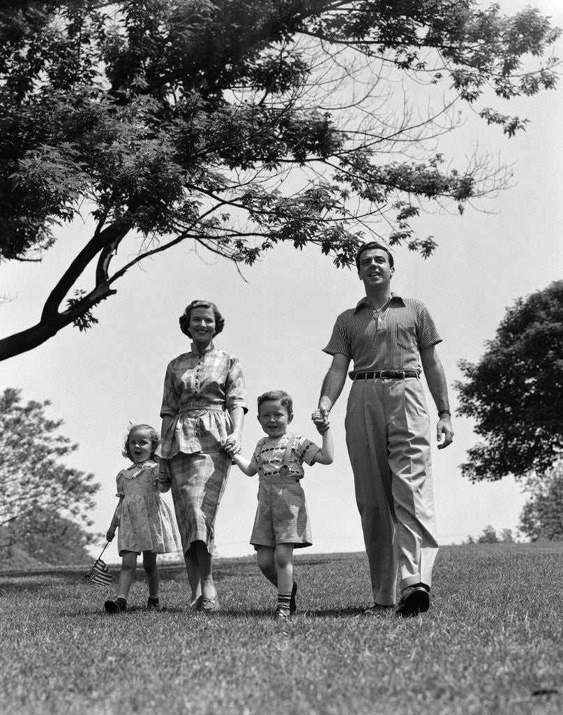 Detail of 1950s Happy Family Mother Father Daughter Son Walking In Park by Anonymous