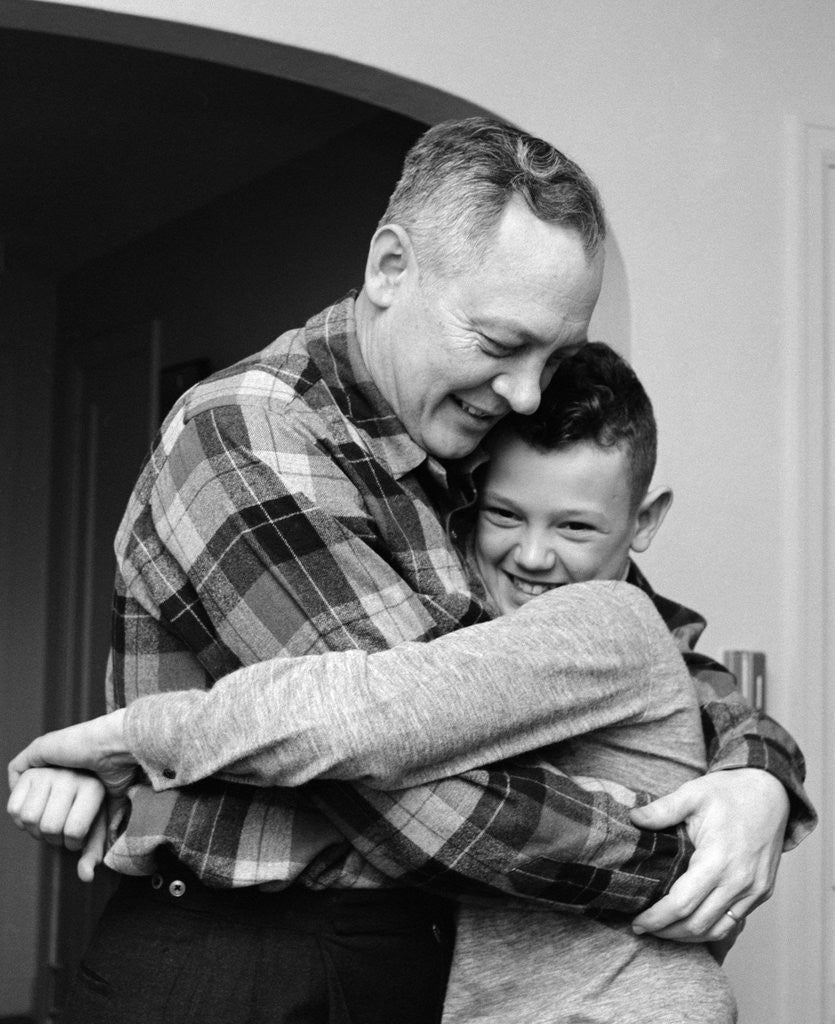 1950s 1960s Father And Son Hugging Indoor by Corbis