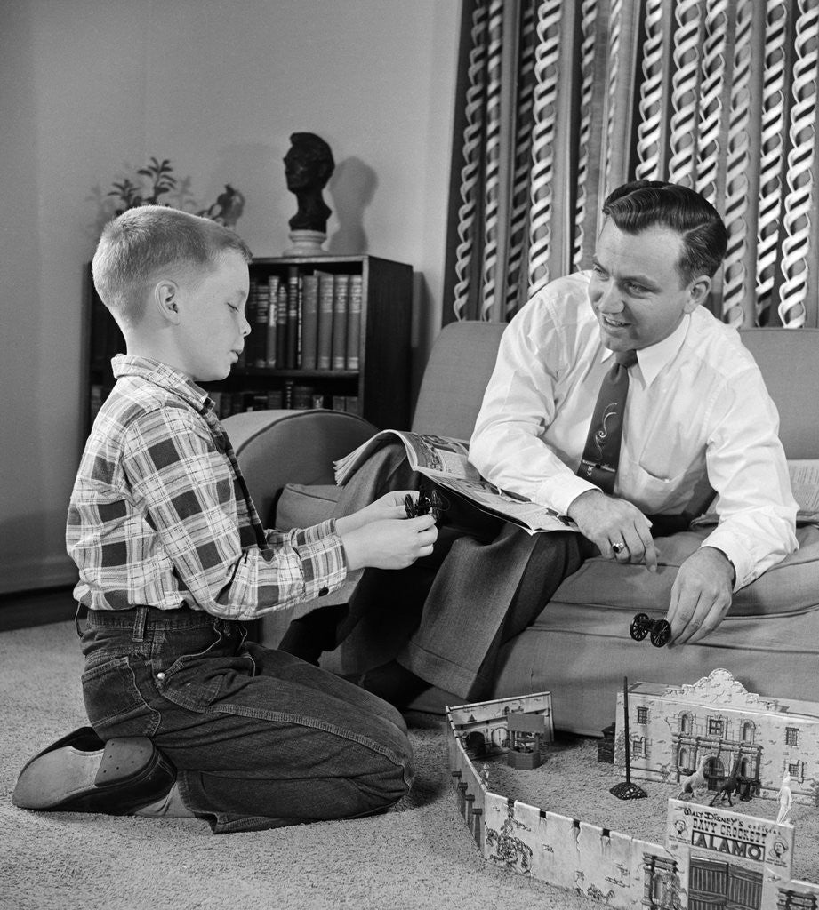 Detail of 1950s Father And Son Playing With Cowboy Toy Game In Living Room Indoor by Corbis