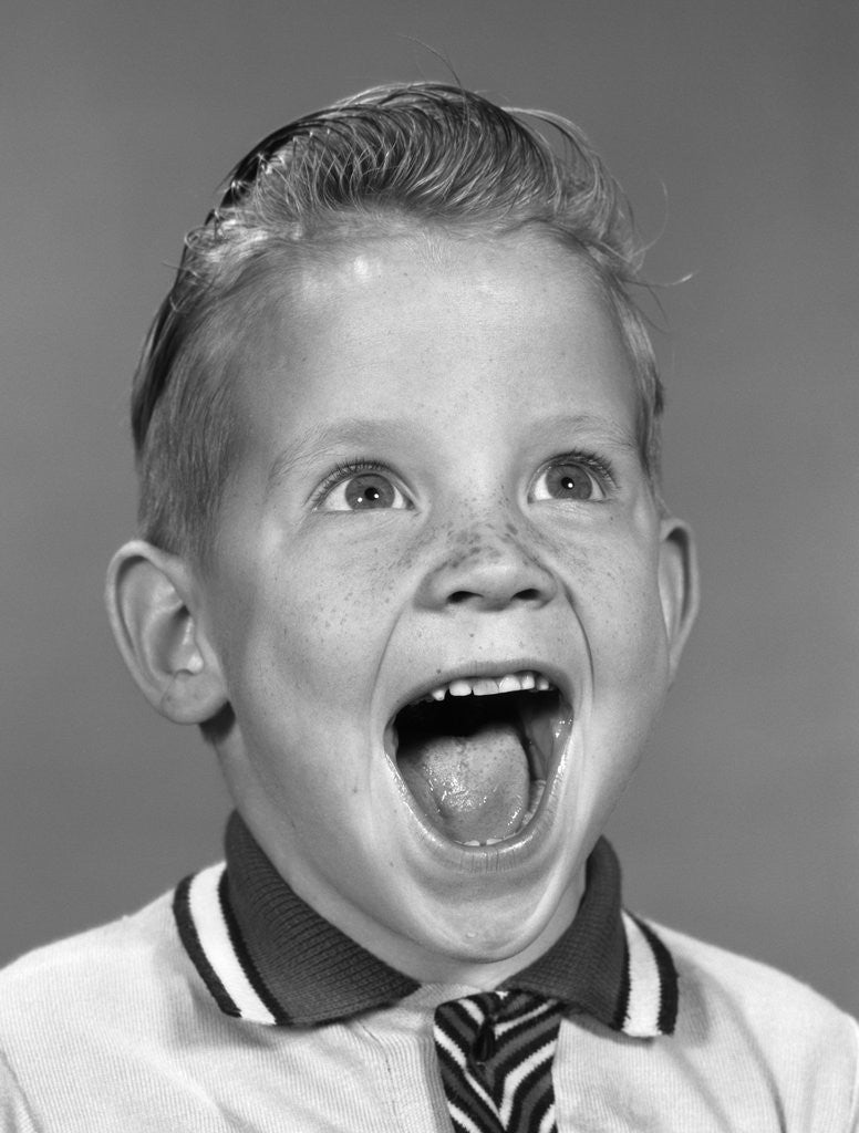 Detail of 1960s Portrait Excited Boy With Mouth Wide Open Laughing by Anonymous