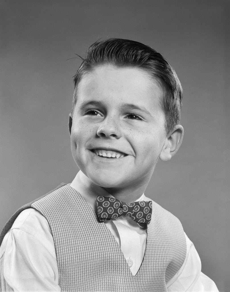 Detail of 1950s Boy Portrait Wearing Checked Vest Polka Dot Bow Tie School Picture by Anonymous