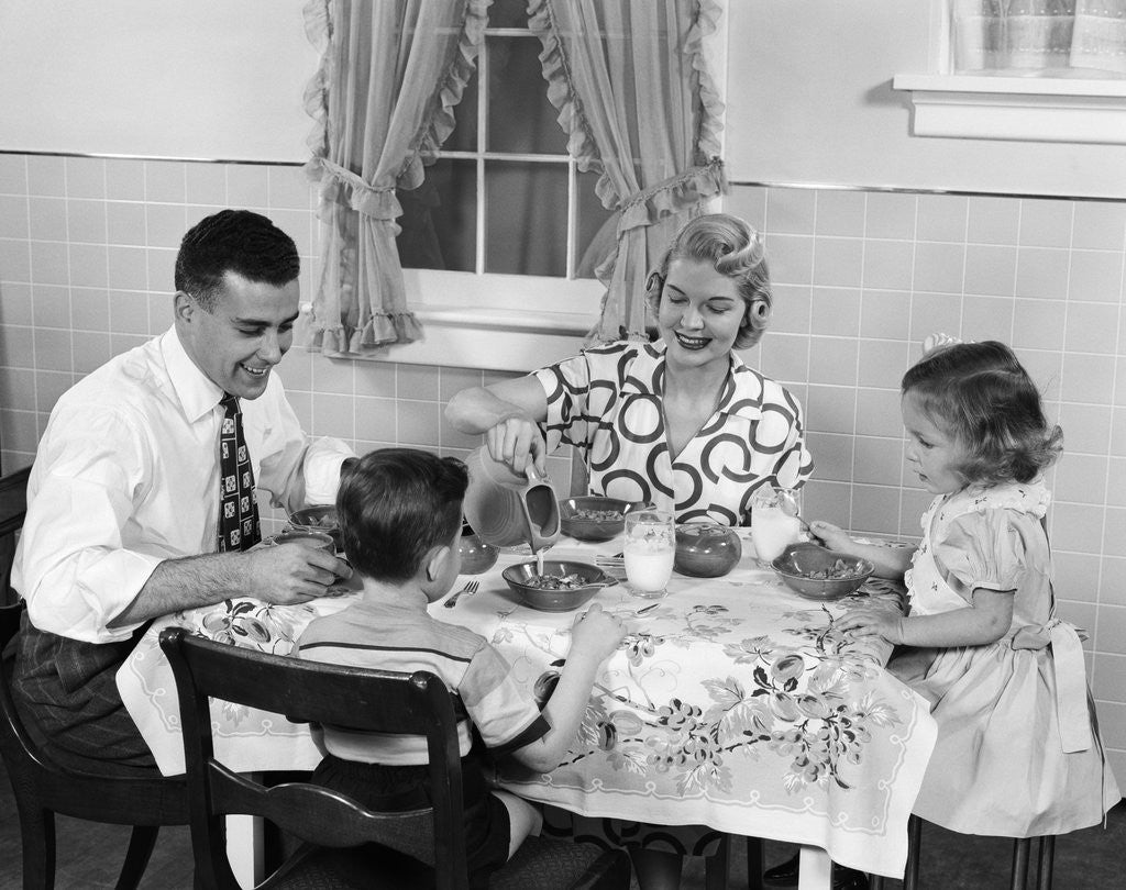 Detail of 1950s Family Sitting At Kitchen Table Having Breakfast by Anonymous