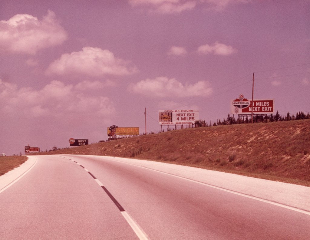 Detail of 1950s 1960s Empty Highway With Billboards by Anonymous