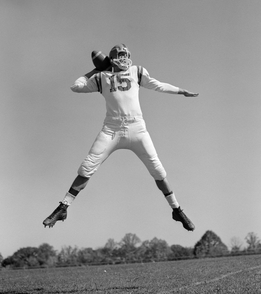 Detail of 1960s Quarterback Jumping And Throwing Pass Football by Anonymous