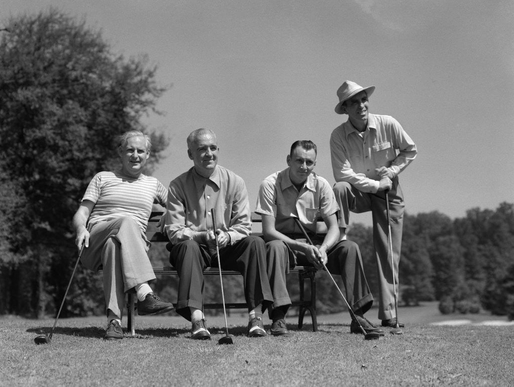 Detail of 1940s 1950s Foursome Of Men Playing Golf Sitting Waiting To Tee-Off by Corbis