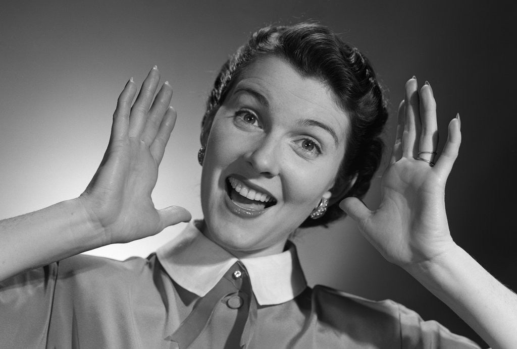 Detail of 1950s Happy Woman Holding Hands Up Beside Her Head by Anonymous
