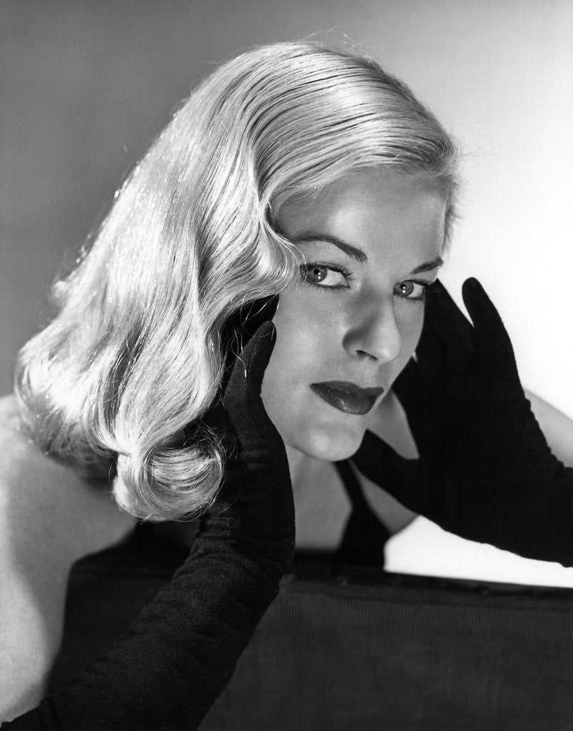 Detail of 1950s Portrait Of Glamorous Woman With Long Black Gloved Hands Touching Cheek by Anonymous