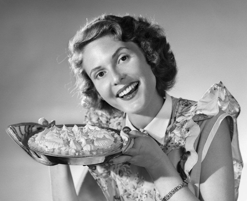 Detail of 1950s Woman Presenting Holding Freshly Baked Pie by Anonymous