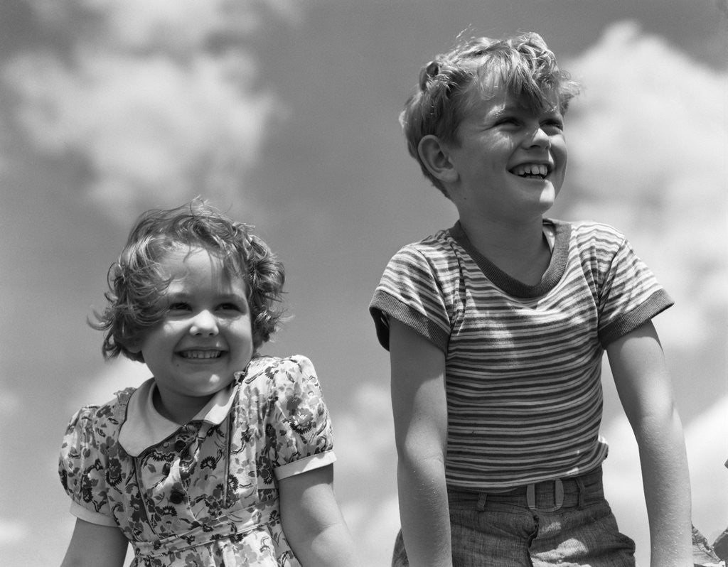 Detail of 1930s Boy And Girl Bright Summer Day Sky With Clouds by Anonymous