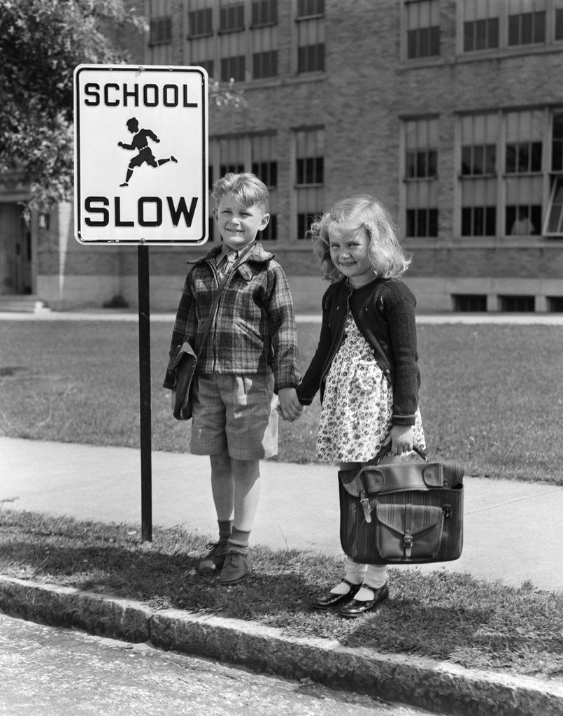 Detail of 1930s 1940s Boy Girl Holding Hands Next To School Slow Sign by Anonymous