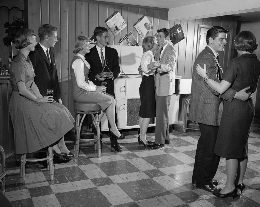 Detail of 1950s 1960s Teen Couples Having Party Dancing In Rec Room by Corbis