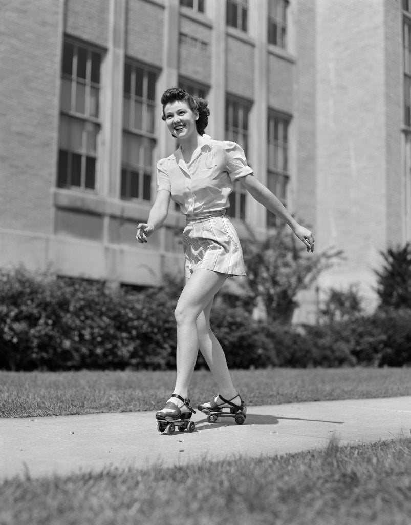 Detail of 1940s Teen Girl On Roller Skates Skating On Sidewalk by Anonymous