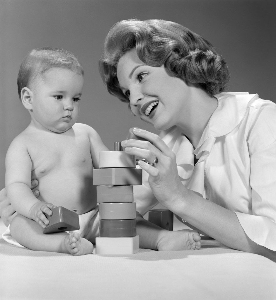 Detail of 1960s Mother And Unhappy Baby Playing With Blocks by Anonymous