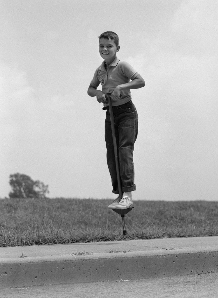 Detail of 1960s Boy Jumping On Pogo Stick by Corbis