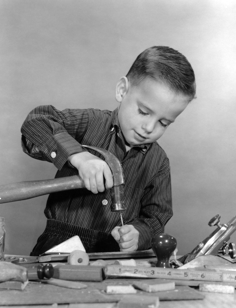 Detail of 1950s Boy Playing With Hammer And Tools by Anonymous
