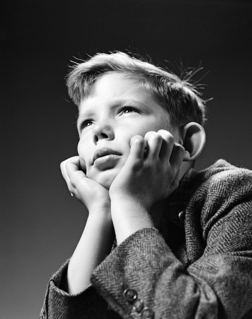 Detail of 1940s Bored Serious Boy Waiting Chin Resting In Hands by Anonymous