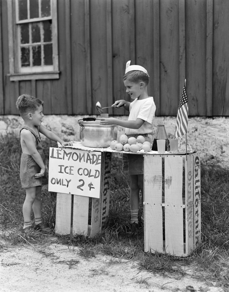 Detail of 1930s 1940s Boy With Lemonade Stand Selling To Little Boy In Short Pants by Anonymous