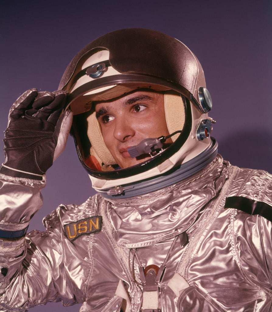 Detail of 1960s Man Astronaut Lifting Up Visor Helmet Wearing Silver Navy Space Suit by Anonymous