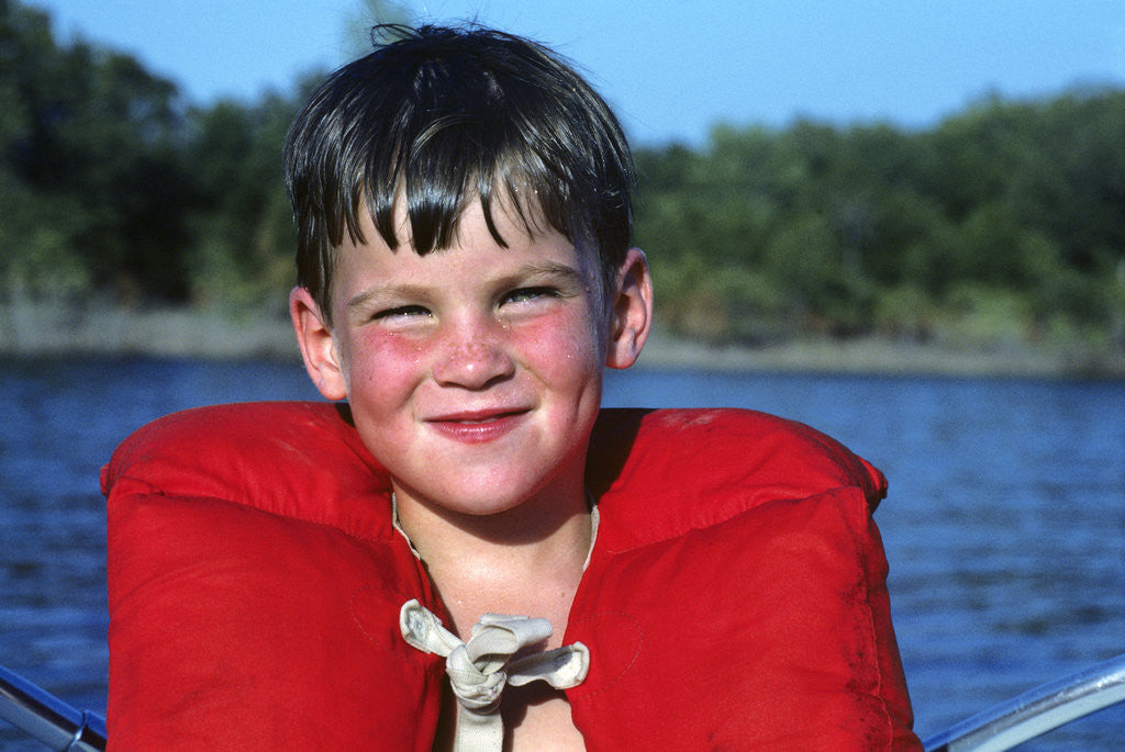Detail of Young Boy Wearing Red Life Preserver by Corbis