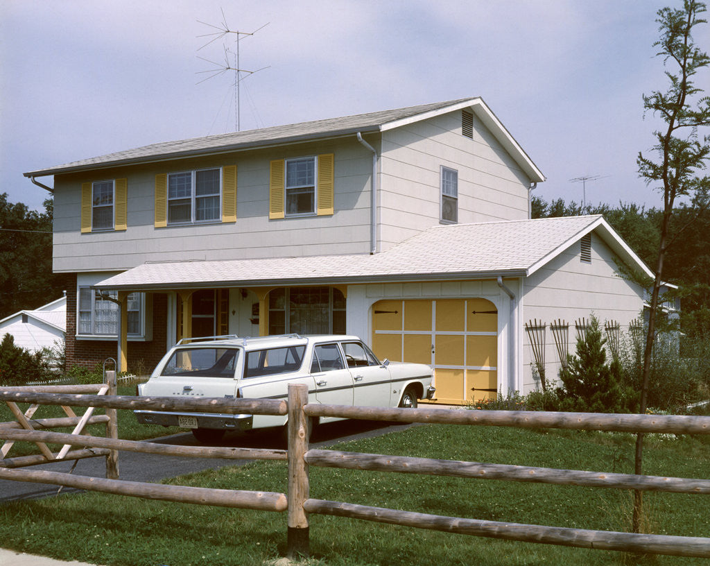 Detail of 1960s 1970s Suburban Home Two Story With Station Wagon In Driveway by Anonymous