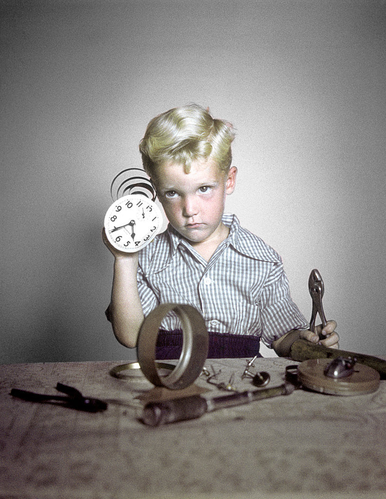Detail of 1950s Funny Curious Little Boy Holding Pliers Tool Taking Apart An Alarm Clock by Anonymous
