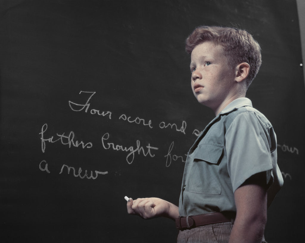 Detail of 1950s Boy with Freckles At History Class Blackboard Writing Gettysburg Address With Chalk by Anonymous