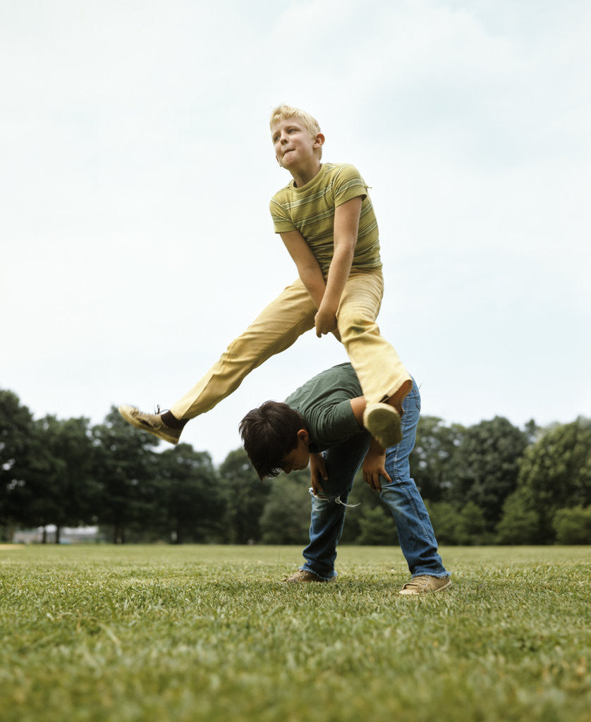 Detail of 1970s Two Boys Jumping Playing Leapfrog by Corbis