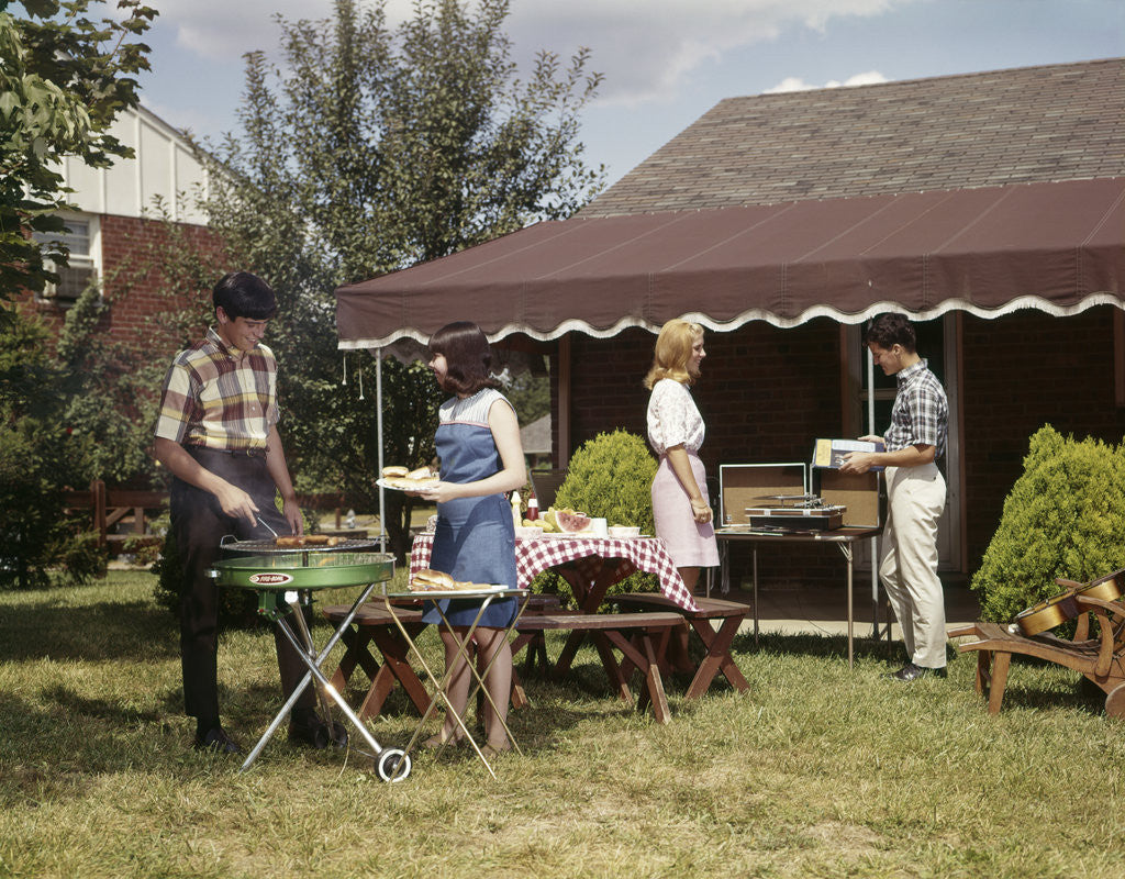 Detail of 1960s Two Teenaged Couples Having Barbecue In Suburban Backyard by Anonymous