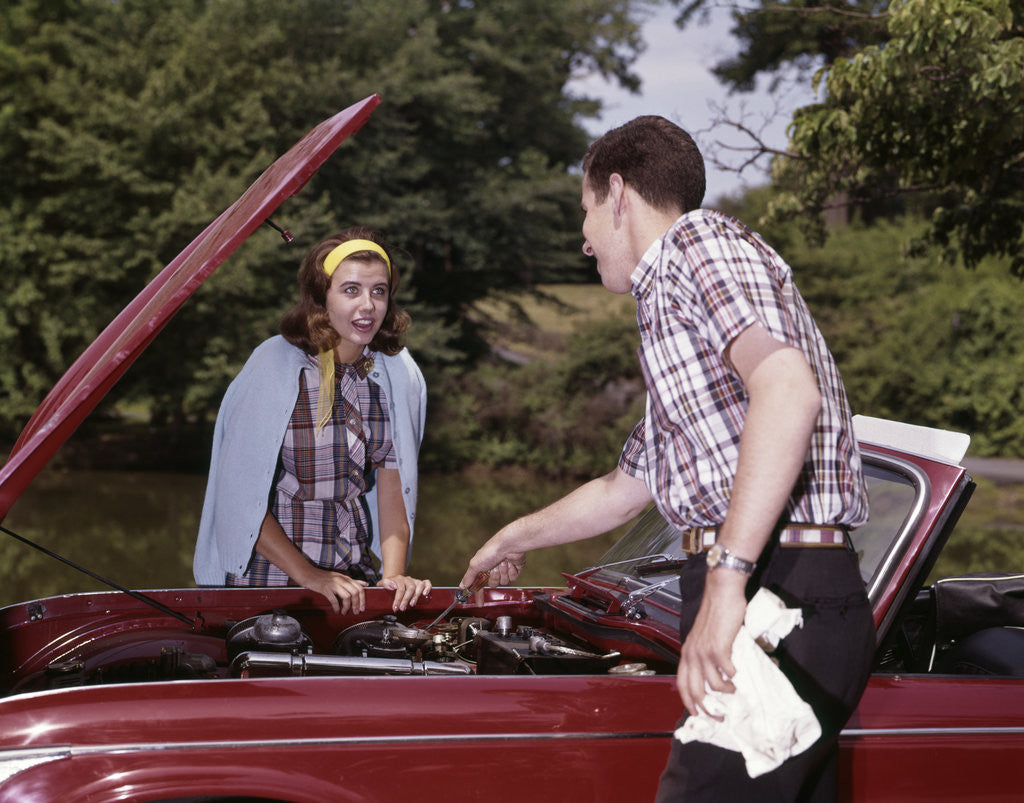 Detail of 1960s Couple By Car With Hood Up Looking At Motor Outdoor Problem Breakdown by Corbis
