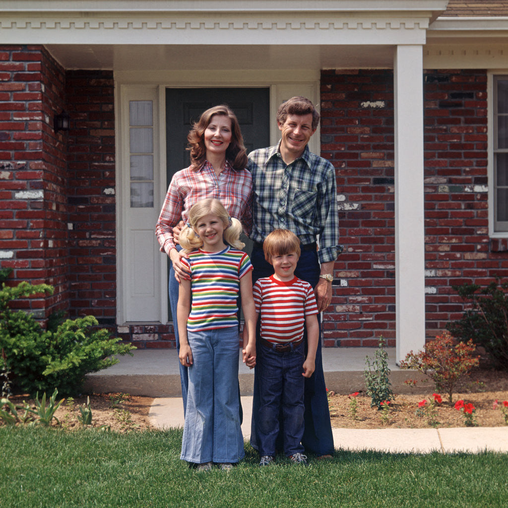 Detail of 1970s Family Posing On Front Lawn Outside House by Corbis