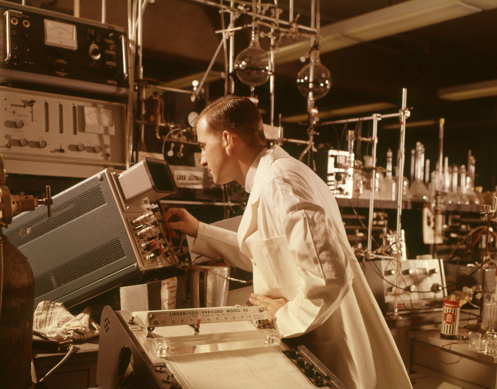 Detail of 1960s Scientist Lab Technician Looking Into Oscilloscope In Laboratory by Corbis